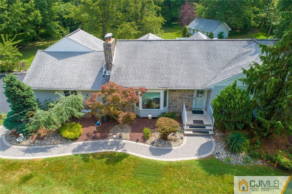 304 Fresh Ponds Road North Brunswick, NJ 08902 - Photo 2 of 44 a aerial view of a house with swimming pool garden and patio