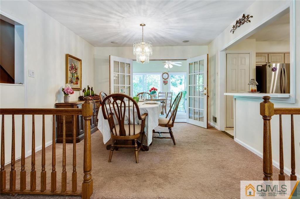 304 Fresh Ponds Road North Brunswick, NJ 08902 - Photo 11 of 44 a view of a dining room with furniture and chandelier