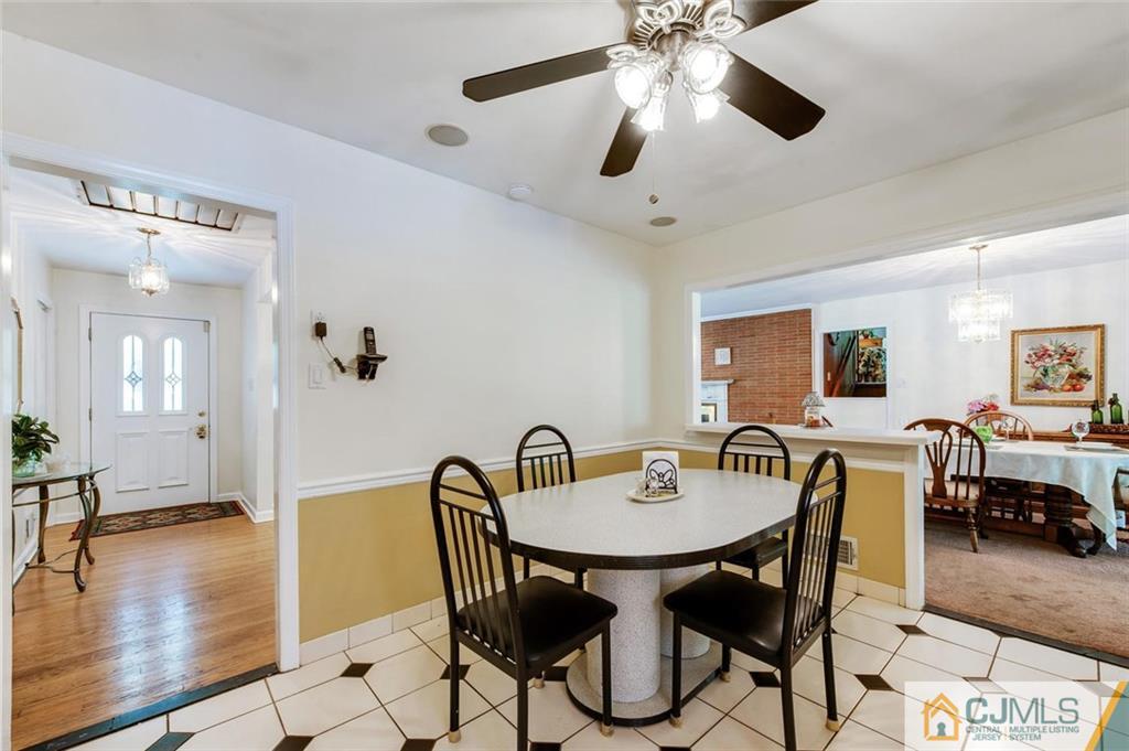 304 Fresh Ponds Road North Brunswick, NJ 08902 - Photo 15 of 44 a view of a dining room with furniture and wooden floor