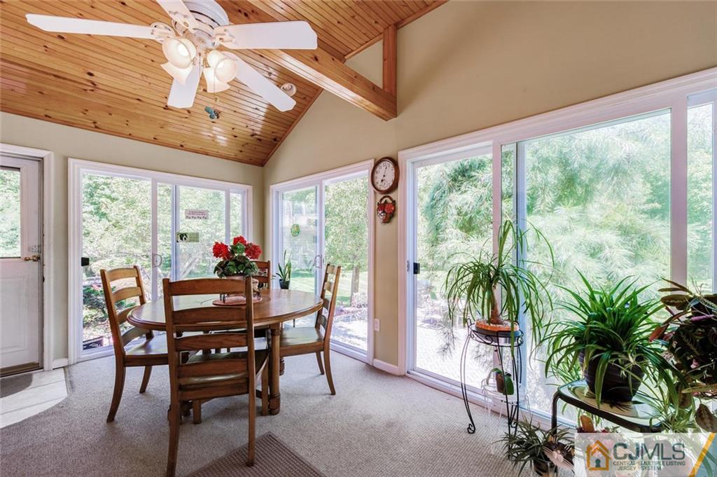304 Fresh Ponds Road North Brunswick, NJ 08902 - Photo 16 of 44 a view of a dining room with furniture window and outside view