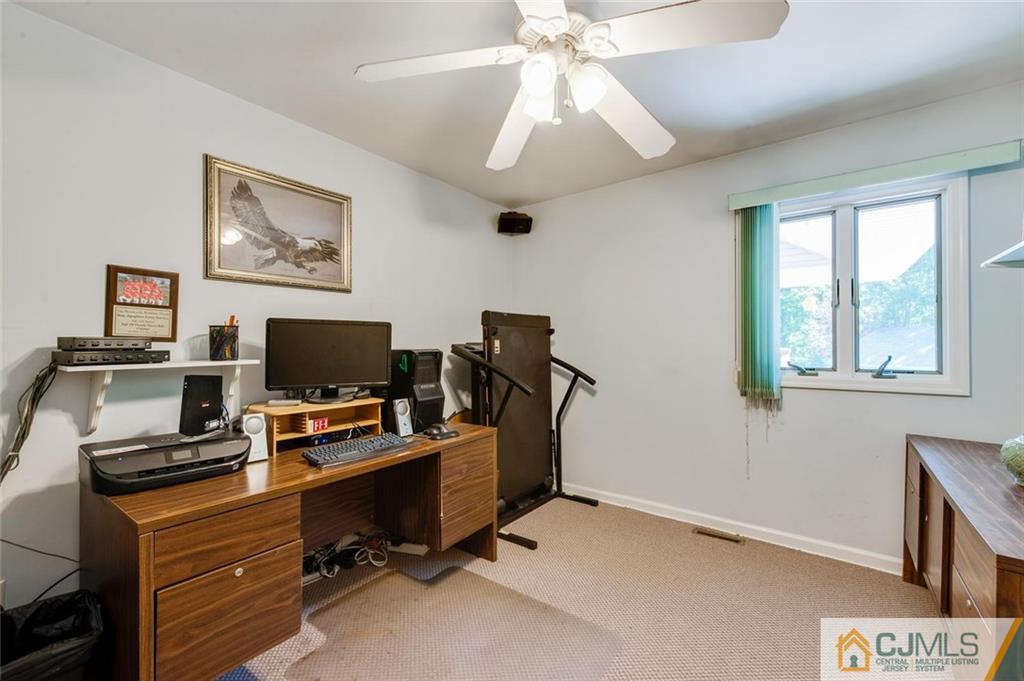 304 Fresh Ponds Road North Brunswick, NJ 08902 - Photo 17 of 44 a view of a workspace with furniture and a window