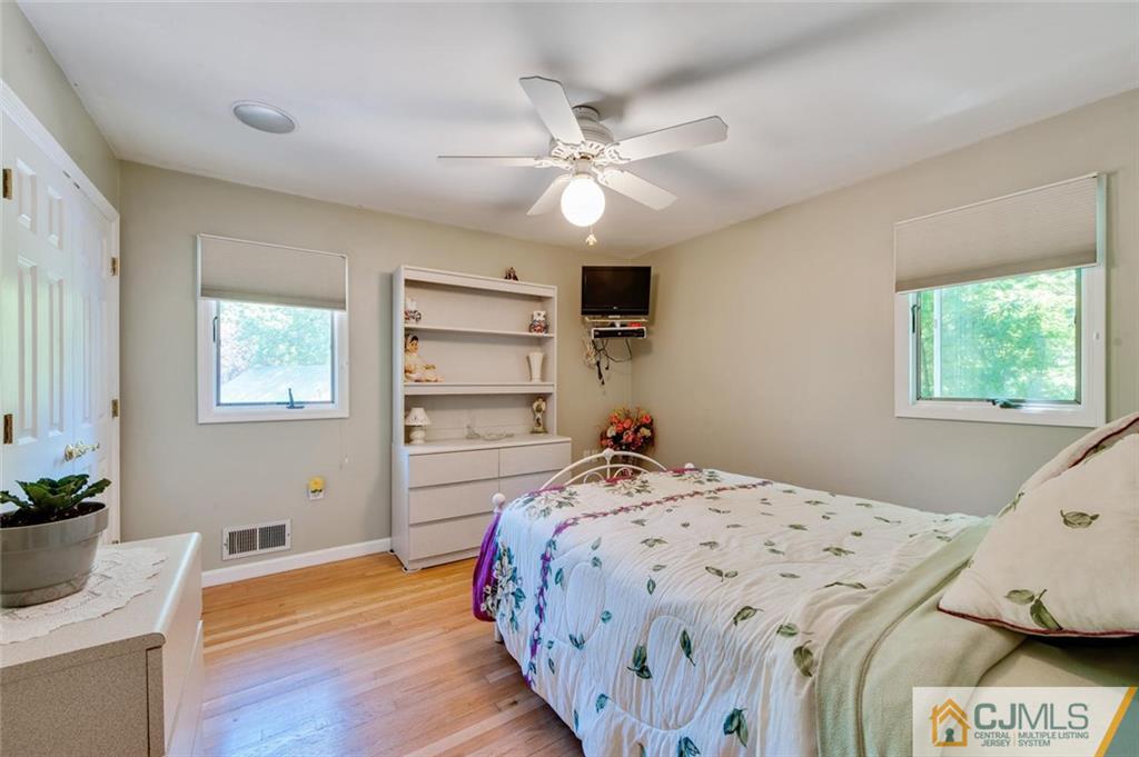 304 Fresh Ponds Road North Brunswick, NJ 08902 - Photo 18 of 44 a bedroom with a bed and a window