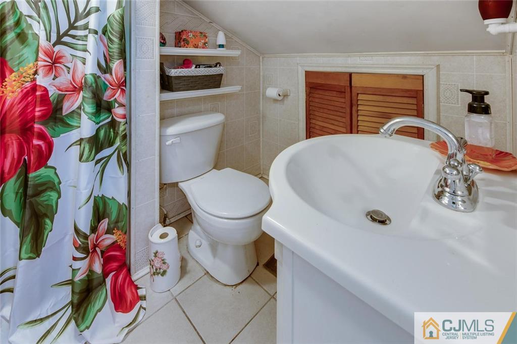 304 Fresh Ponds Road North Brunswick, NJ 08902 - Photo 23 of 44 a bathroom with a sink toilet and shower