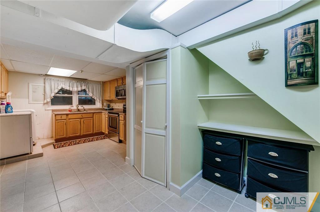 304 Fresh Ponds Road North Brunswick, NJ 08902 - Photo 25 of 44 a kitchen with a refrigerator and stove