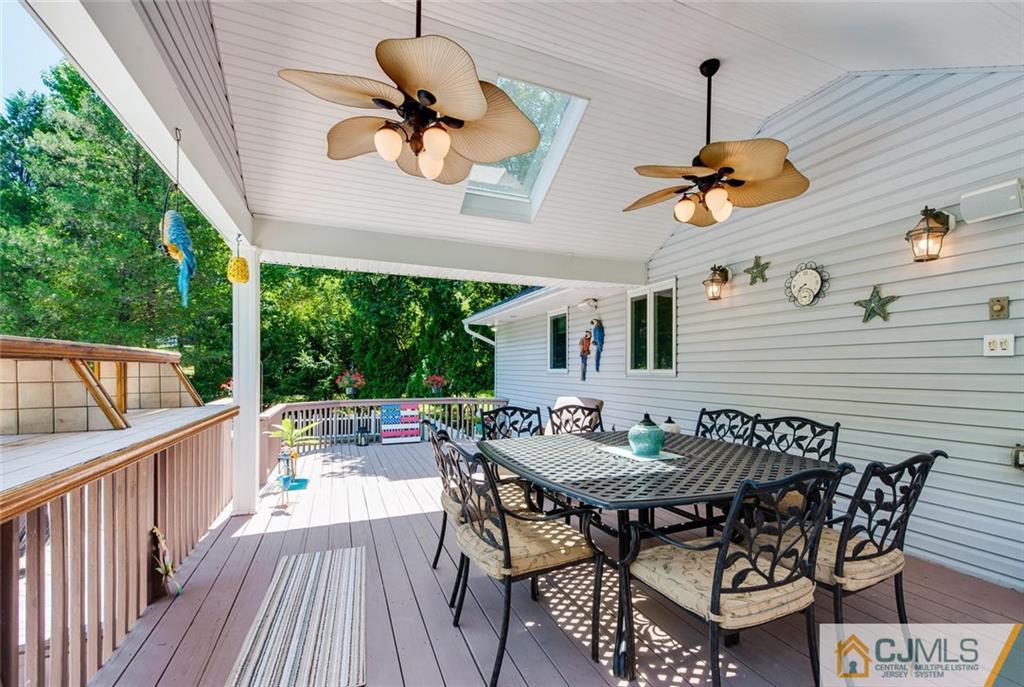 304 Fresh Ponds Road North Brunswick, NJ 08902 - Photo 30 of 44 a view of a dinning table and chairs in patio of the house
