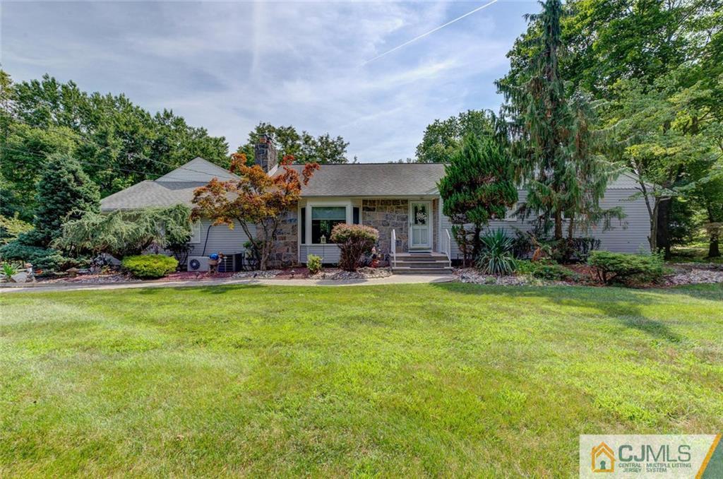 304 Fresh Ponds Road North Brunswick, NJ 08902 - Photo 4 of 44 a front view of a house with garden