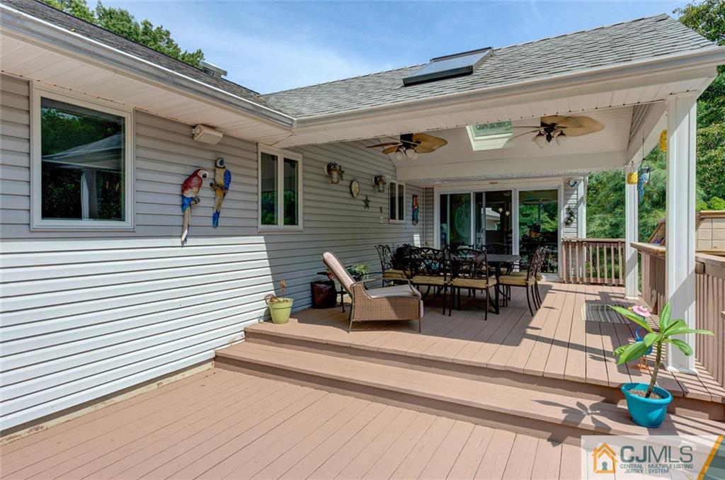304 Fresh Ponds Road North Brunswick, NJ 08902 - Photo 31 of 44 a view of a patio with couches table and chairs and potted plants