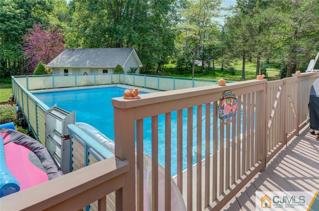 304 Fresh Ponds Road North Brunswick, NJ 08902 - Photo 32 of 44 a view of a wooden deck and a backyard