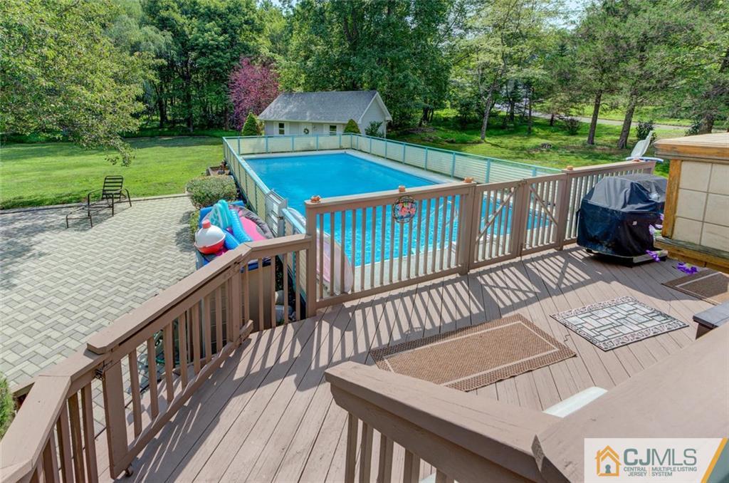 304 Fresh Ponds Road North Brunswick, NJ 08902 - Photo 33 of 44 a view of a deck with a yard