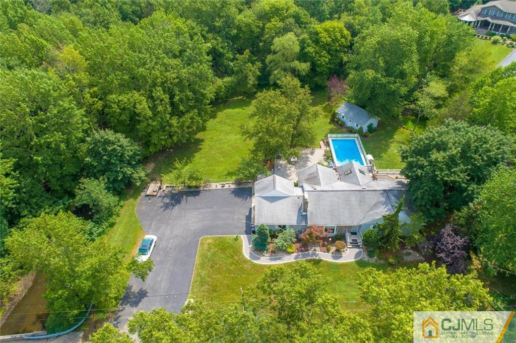 304 Fresh Ponds Road North Brunswick, NJ 08902 - Photo 41 of 44 a view of a house with a yard and large trees