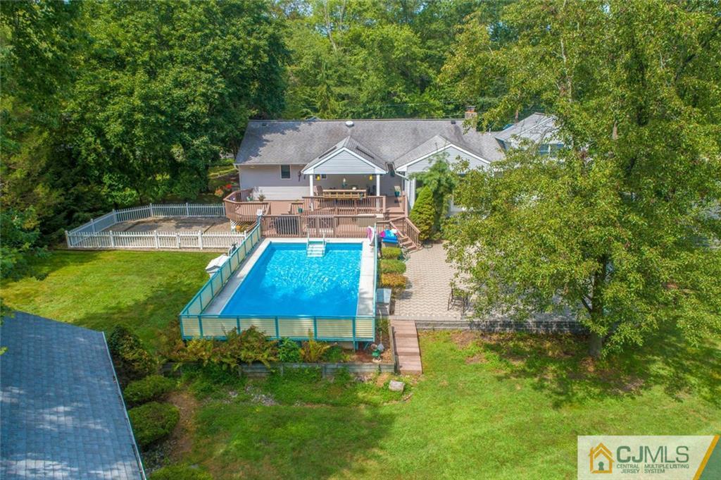 304 Fresh Ponds Road North Brunswick, NJ 08902 - Photo 42 of 44 an aerial view of a house with swimming pool garden and patio