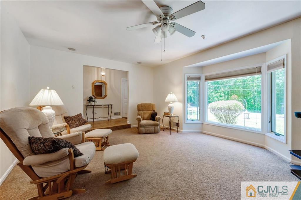 304 Fresh Ponds Road North Brunswick, NJ 08902 - Photo 8 of 44 a living room with furniture and a large window