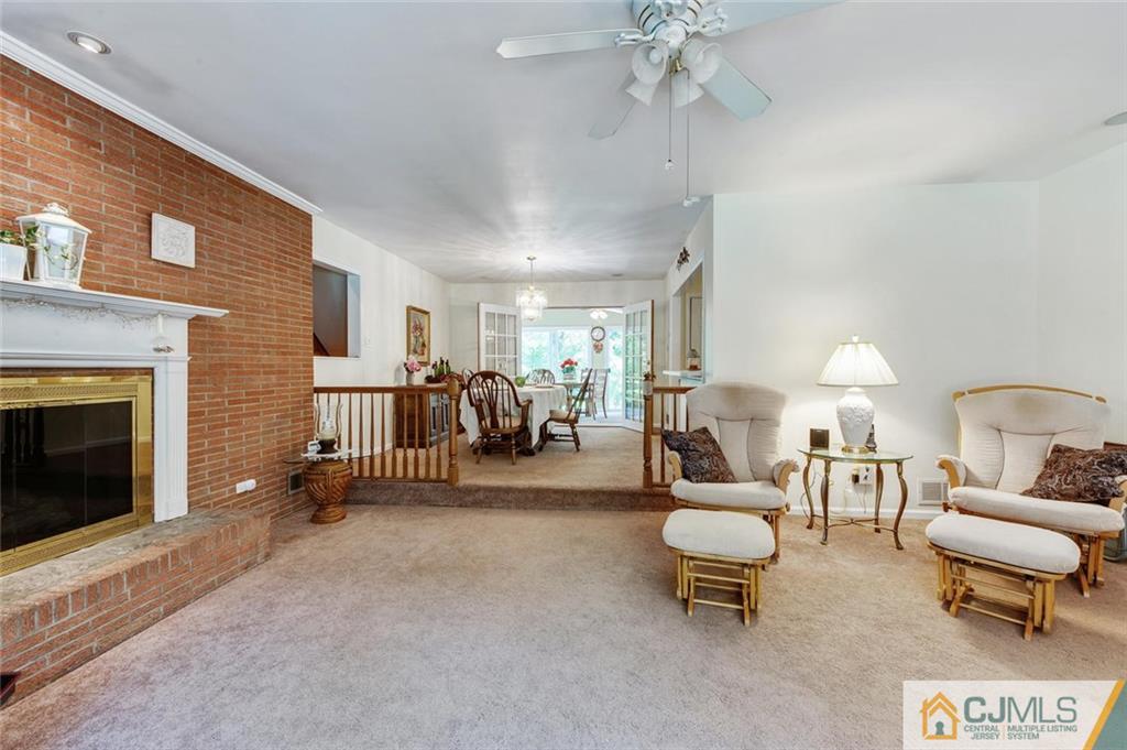 304 Fresh Ponds Road North Brunswick, NJ 08902 - Photo 9 of 44 a living room with furniture and a fireplace