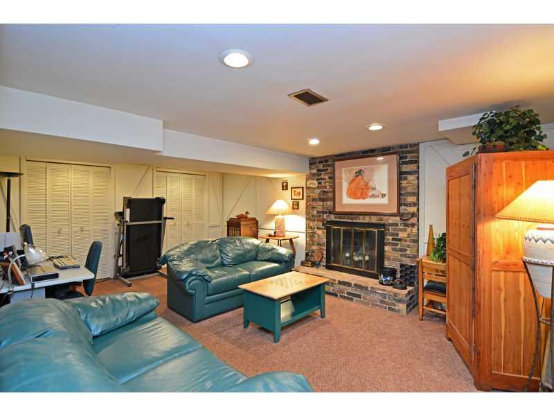 1736 Fox Chapel Road Pittsburgh, PA 15238 - Photo 12 of 25 Family Room. The versatile lower level family room provides a second brick fireplace, plus storage space and an adjoining laundry room.