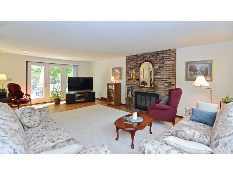 1736 Fox Chapel Road Pittsburgh, PA 15238 - Photo 3 of 25 Living Room. Just off the entry, the spacious living room features hardwood flooring, neutral dcor and a handsome brick fireplace.