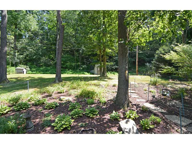 1736 Fox Chapel Road Pittsburgh, PA 15238 - Photo 22 of 25 Exterior Back. Spacious and scenic garden areas separate the deck and the back yard.