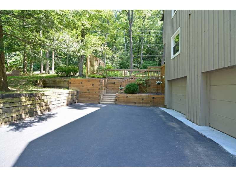 1736 Fox Chapel Road Pittsburgh, PA 15238 - Photo 25 of 25 Parking Lot/Garage. The two-car garage opens to a level upper driveway, with easy access to the back yard.