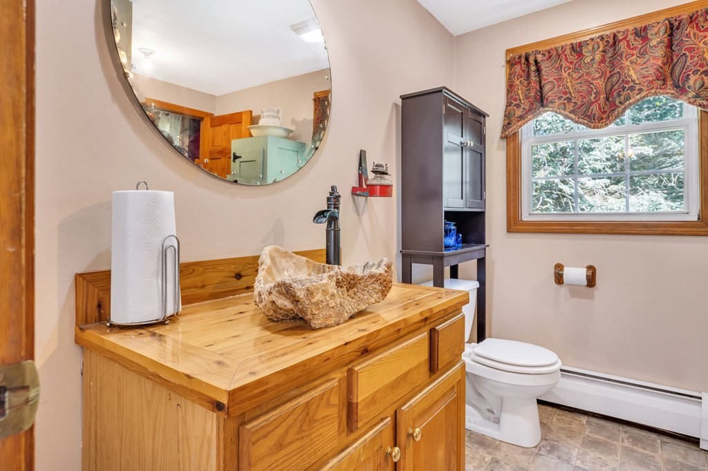 171 Sturbridge Road Holland, MA 01521 - Photo 26 of 34 a bathroom with a sink a toilet and a mirror