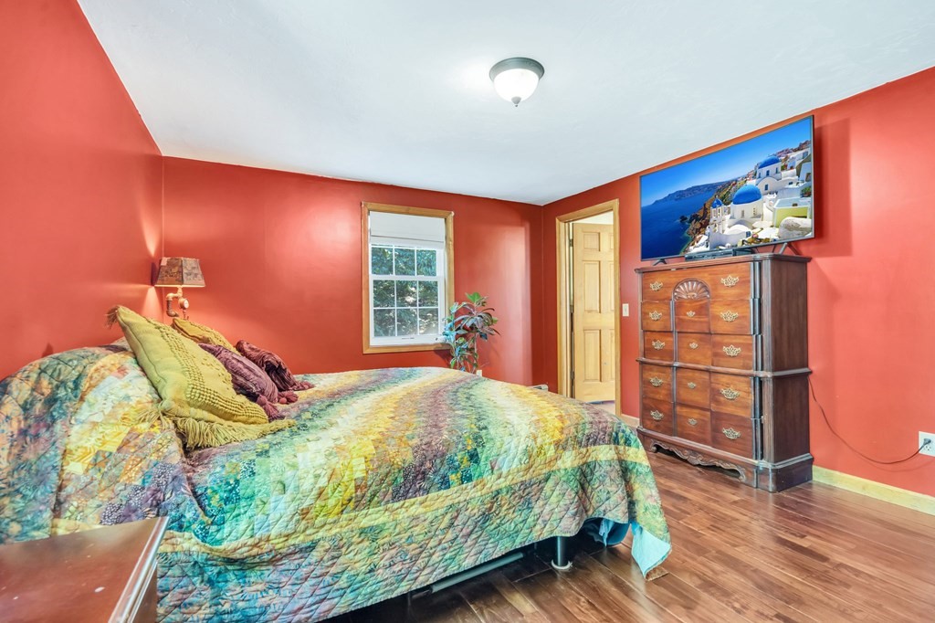 171 Sturbridge Road Holland, MA 01521 - Photo 30 of 34 a bedroom with bed and wooden floor
