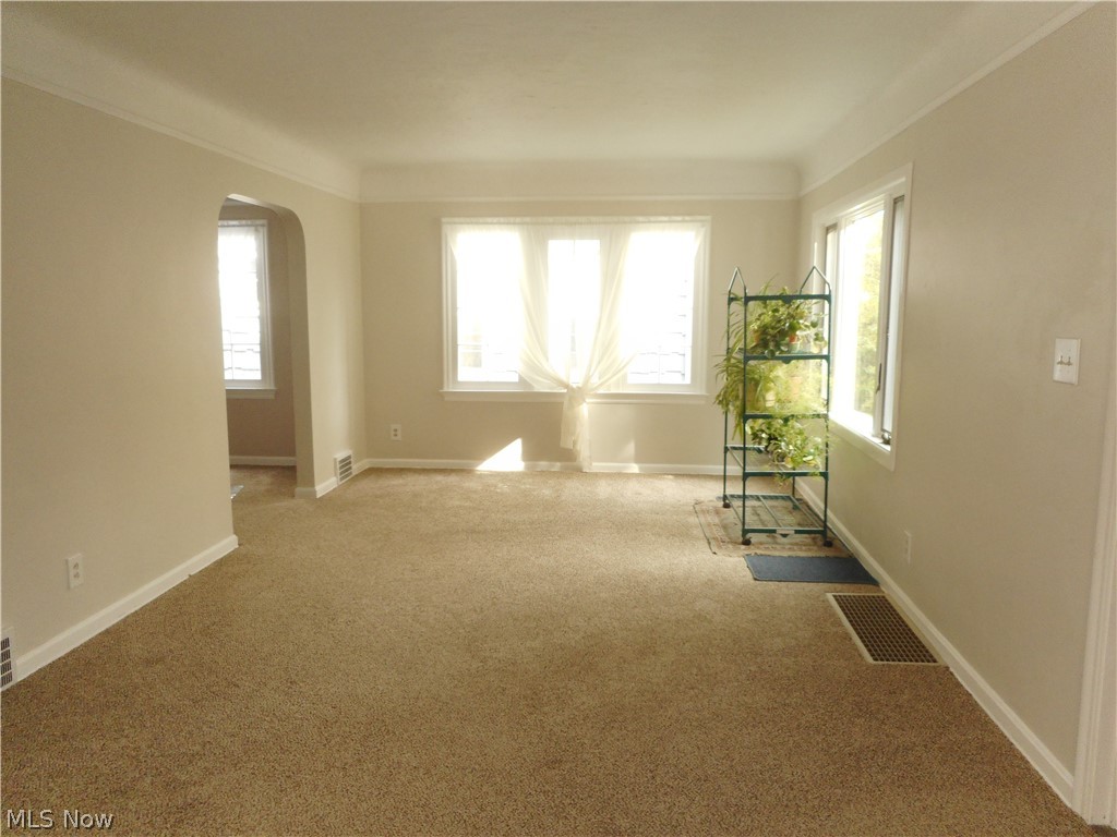 1150 Castleton Road Cleveland Heights, OH 44121 - Photo 9 of 25 So much space here in another view of the main living area. New carpet, paint and bright, sunny windows!