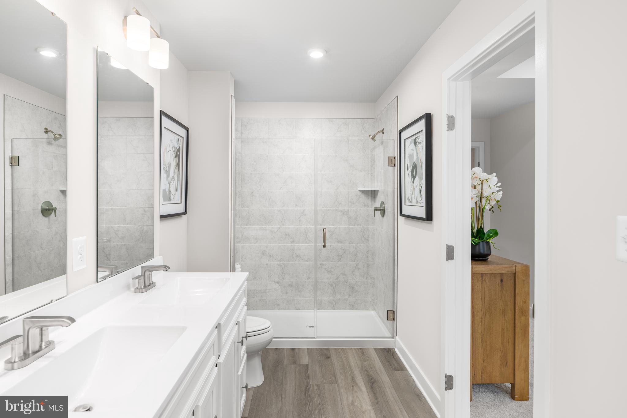 8428 Branch Side Way, Unit D Brandywine, MD 20613 - Photo 15 of 23 a bathroom with a sink a toilet and shower