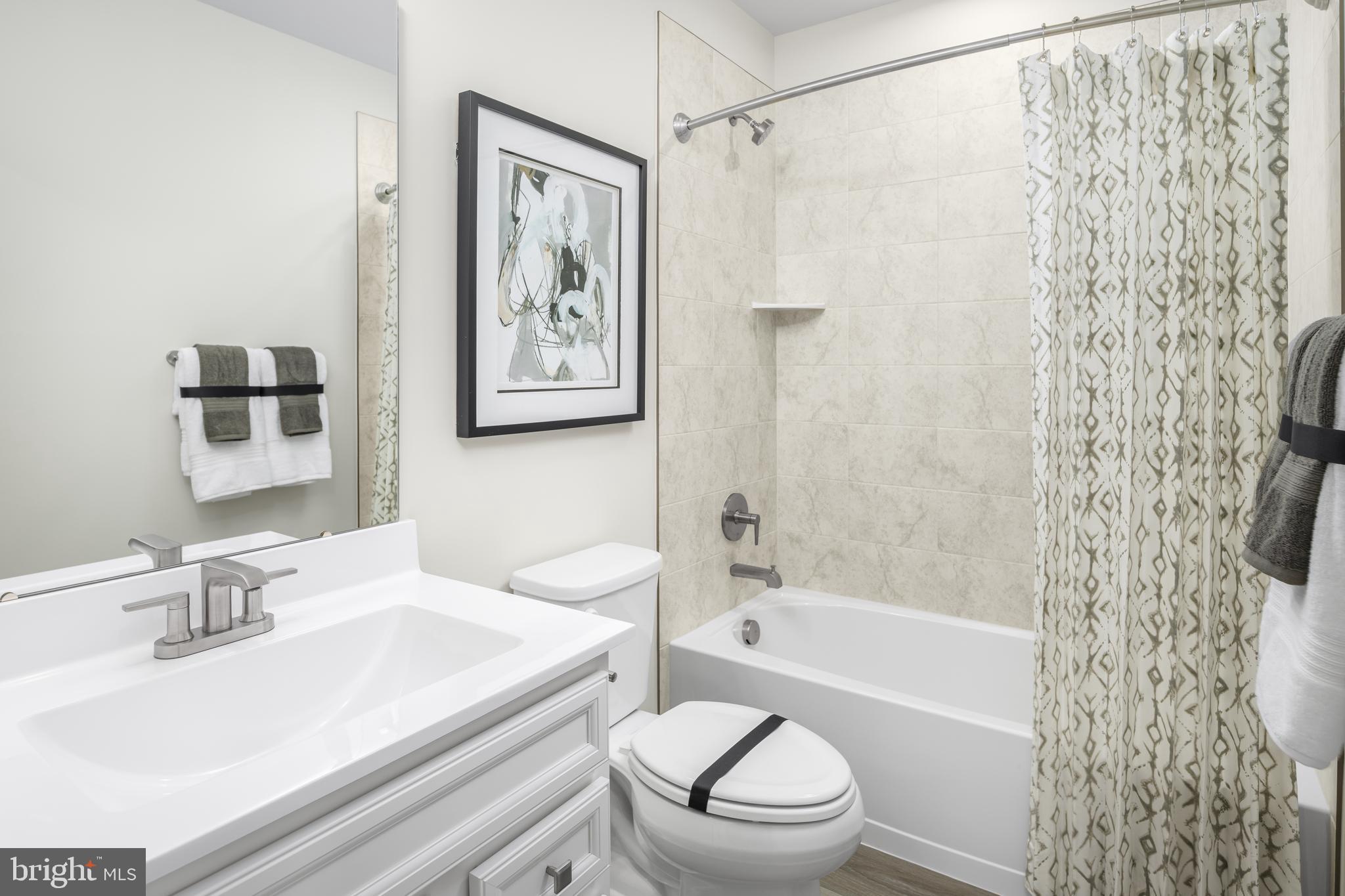 8428 Branch Side Way, Unit D Brandywine, MD 20613 - Photo 20 of 23 a bathroom with a sink toilet and shower