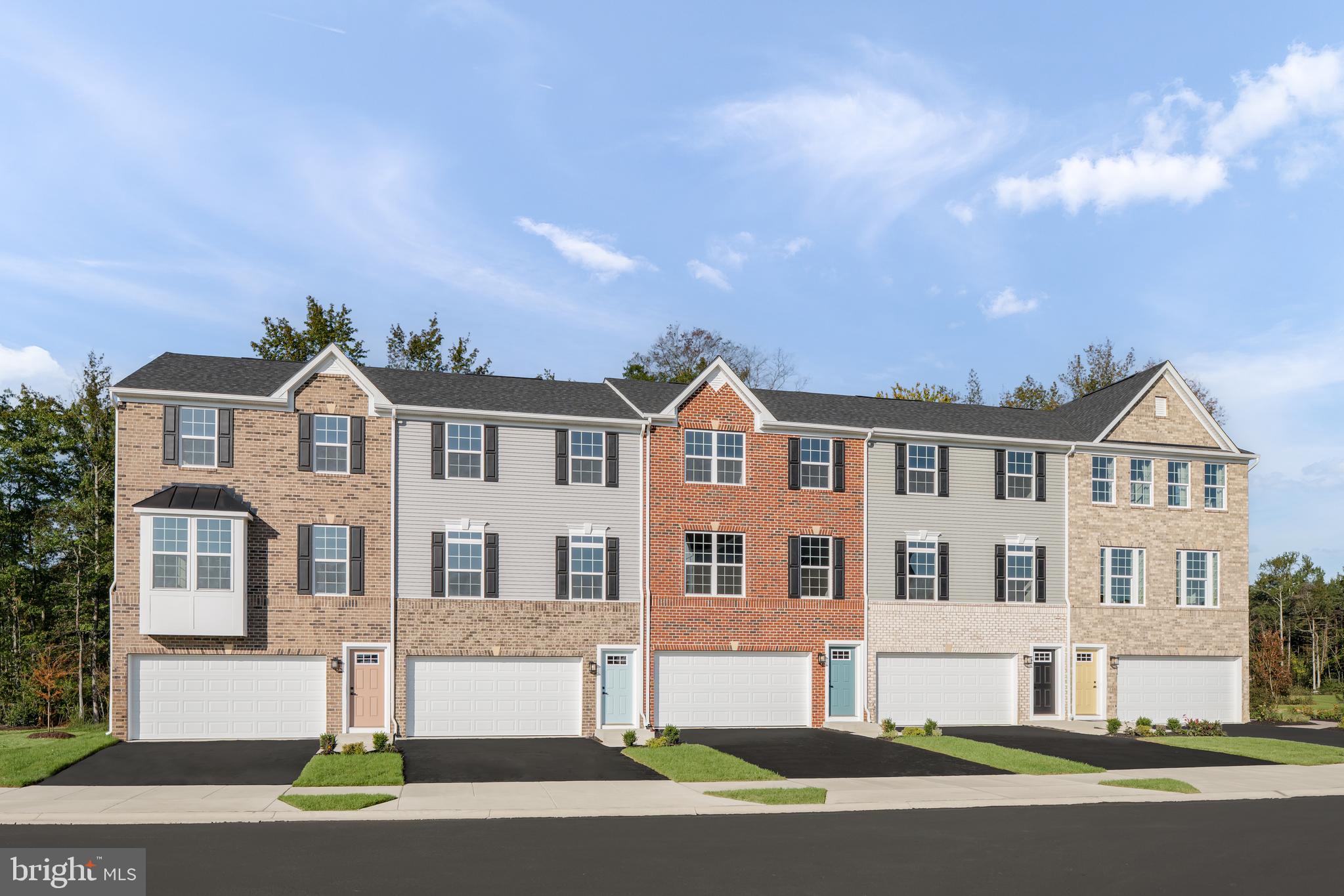 8428 Branch Side Way, Unit D Brandywine, MD 20613 - Photo 23 of 23 a front view of a house with a yard