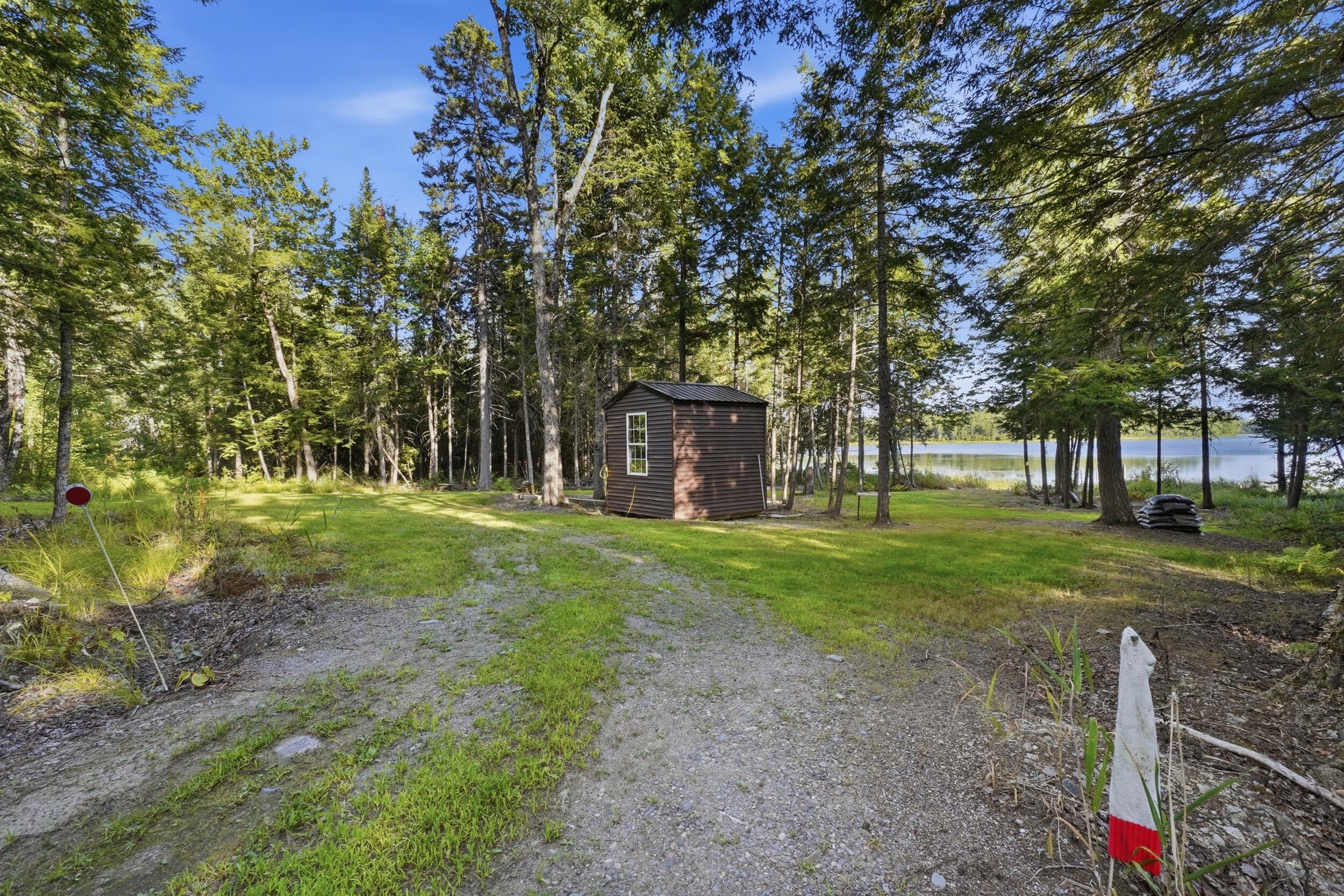 395 Lee Road Lincoln, ME 04457 - Photo 47 of 61 049_395lee_lakeside_camp_approach
