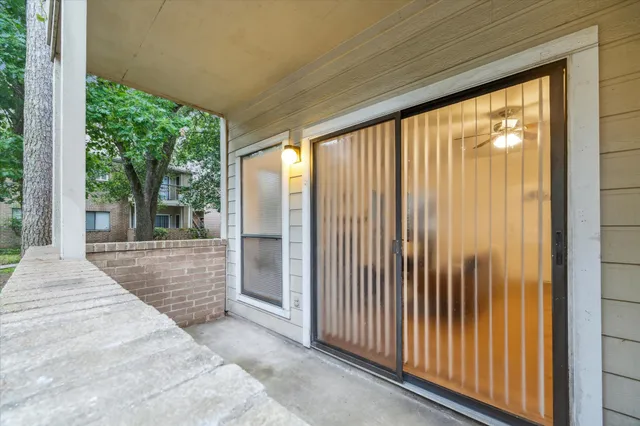 a view of a porch with wooden floor and outdoor space
