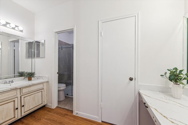 a bathroom with a sink a mirror and a toilet
