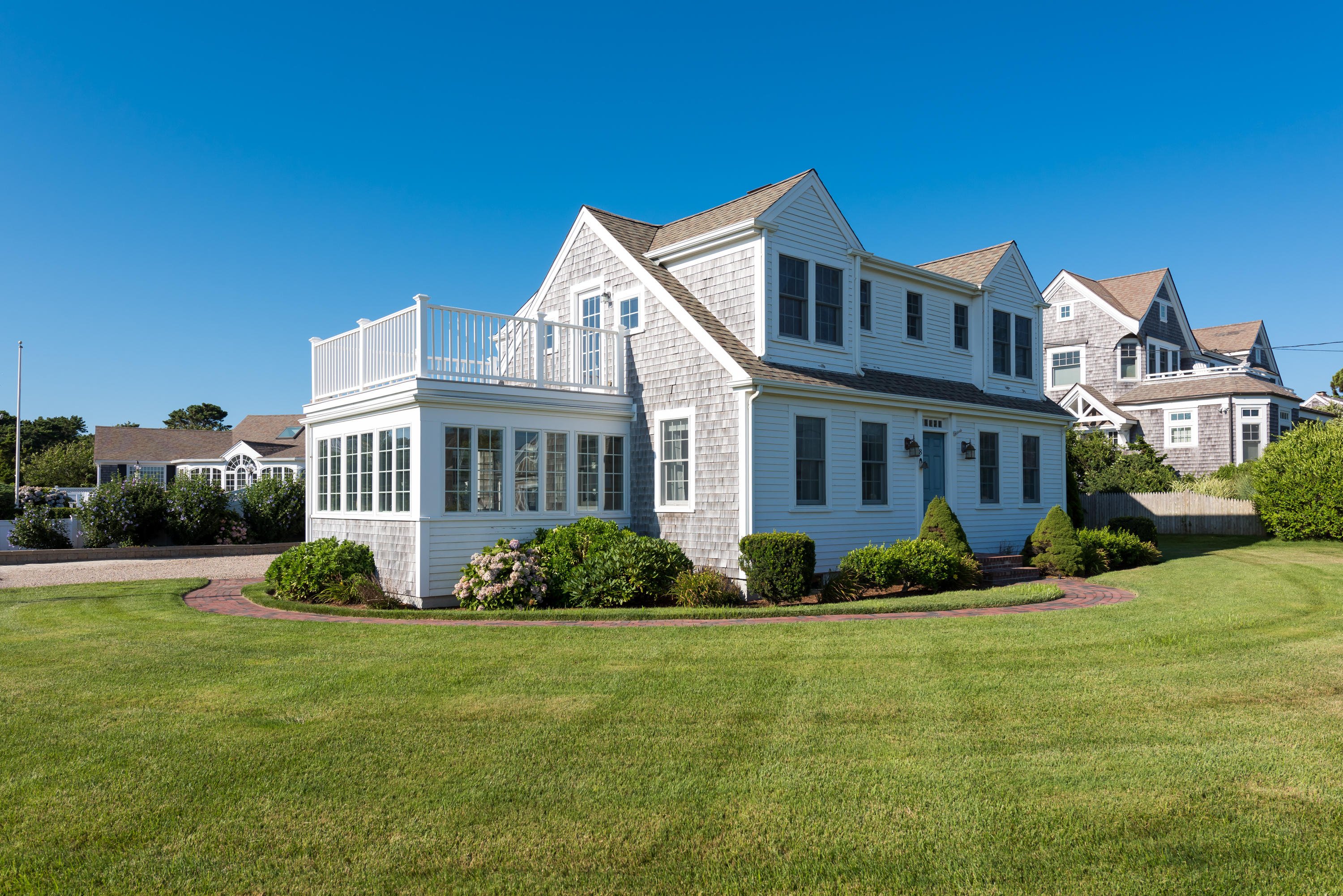 8 Shore Road West Harwich, MA 02671 - Photo 1 of 5 a front view of a house with a yard