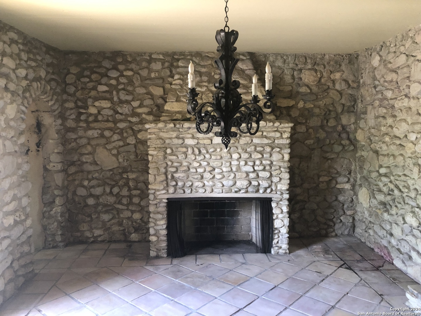 6617 Countess Adria Street Leon Valley, TX 78238 - Photo 12 of 20 a room with a fireplace