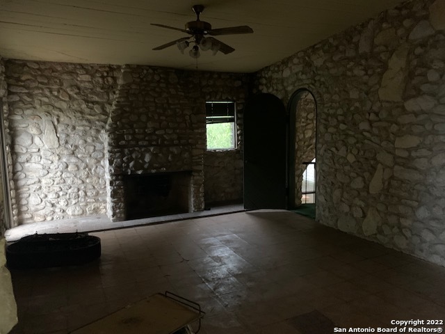 6617 Countess Adria Street Leon Valley, TX 78238 - Photo 14 of 20 wooden floor in an empty room with a window