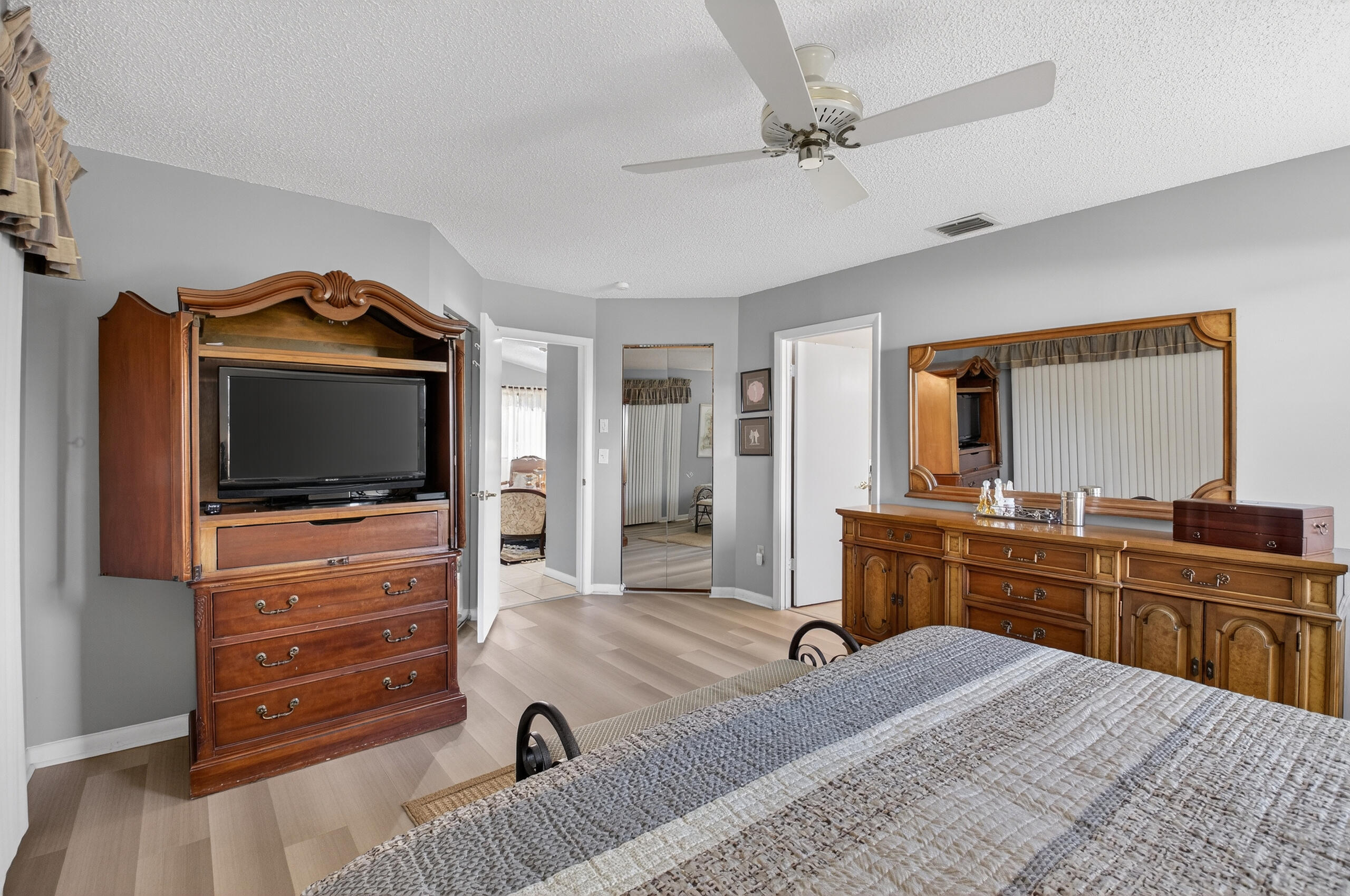 2601 Northwest 15th Street Delray Beach, FL 33445 - Photo 23 of 59 a bedroom with a bed and a flat screen tv
