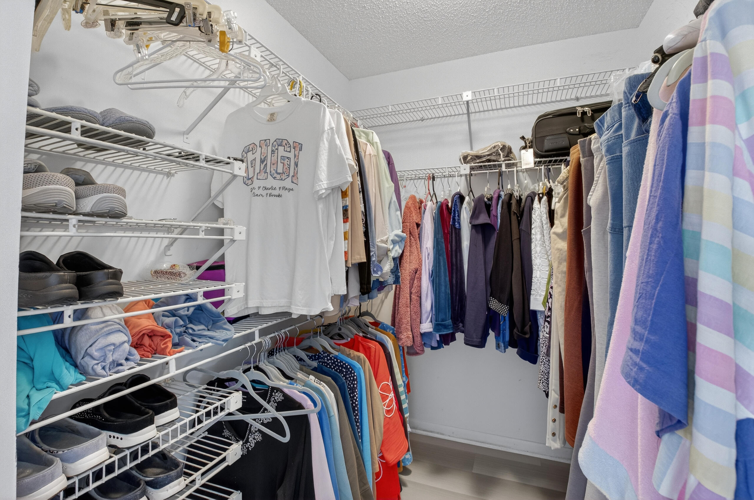 2601 Northwest 15th Street Delray Beach, FL 33445 - Photo 24 of 59 a view of walk in closet with clothes and shoes