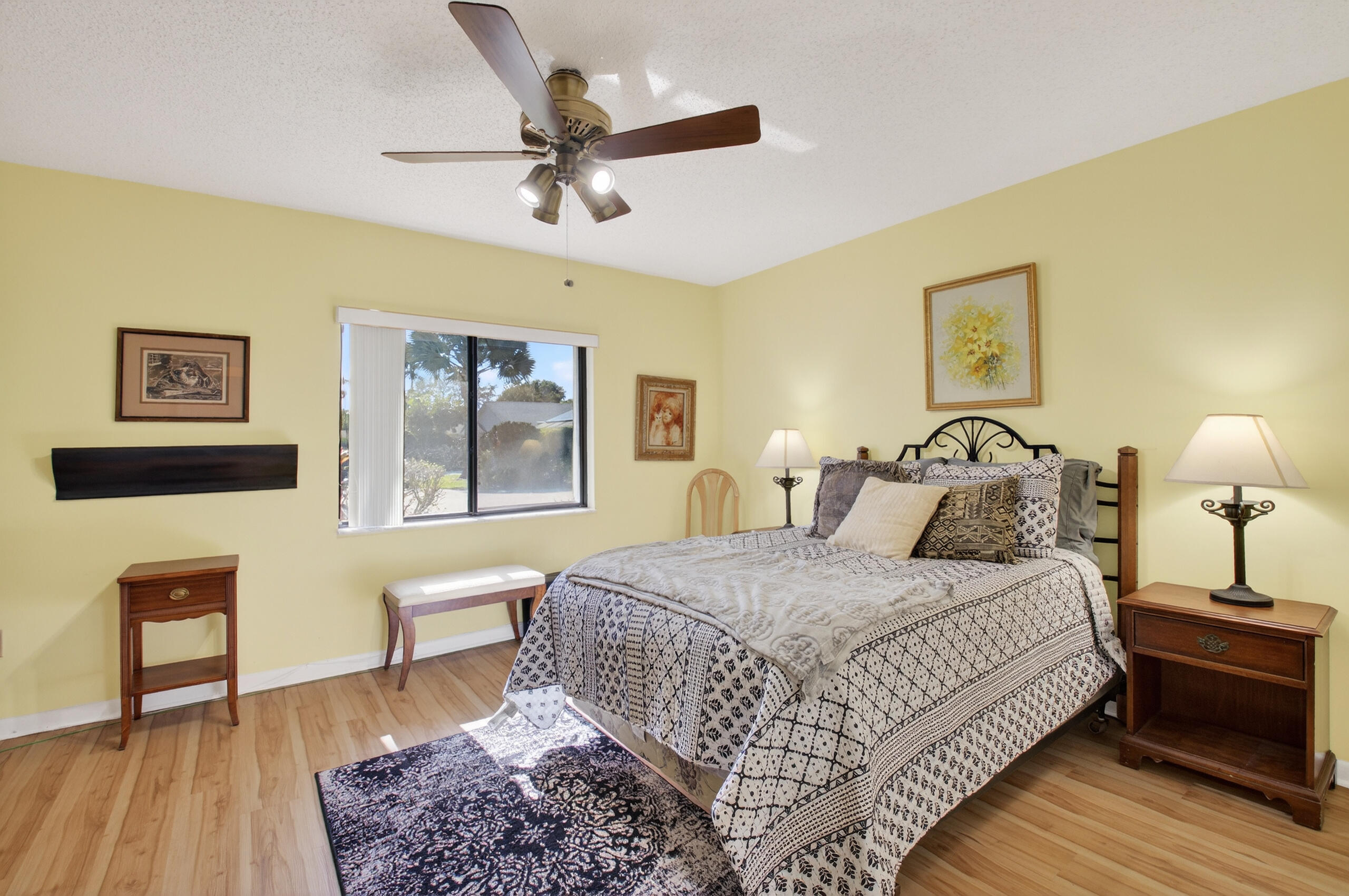 2601 Northwest 15th Street Delray Beach, FL 33445 - Photo 27 of 59 a bedroom with a bed and a chandelier