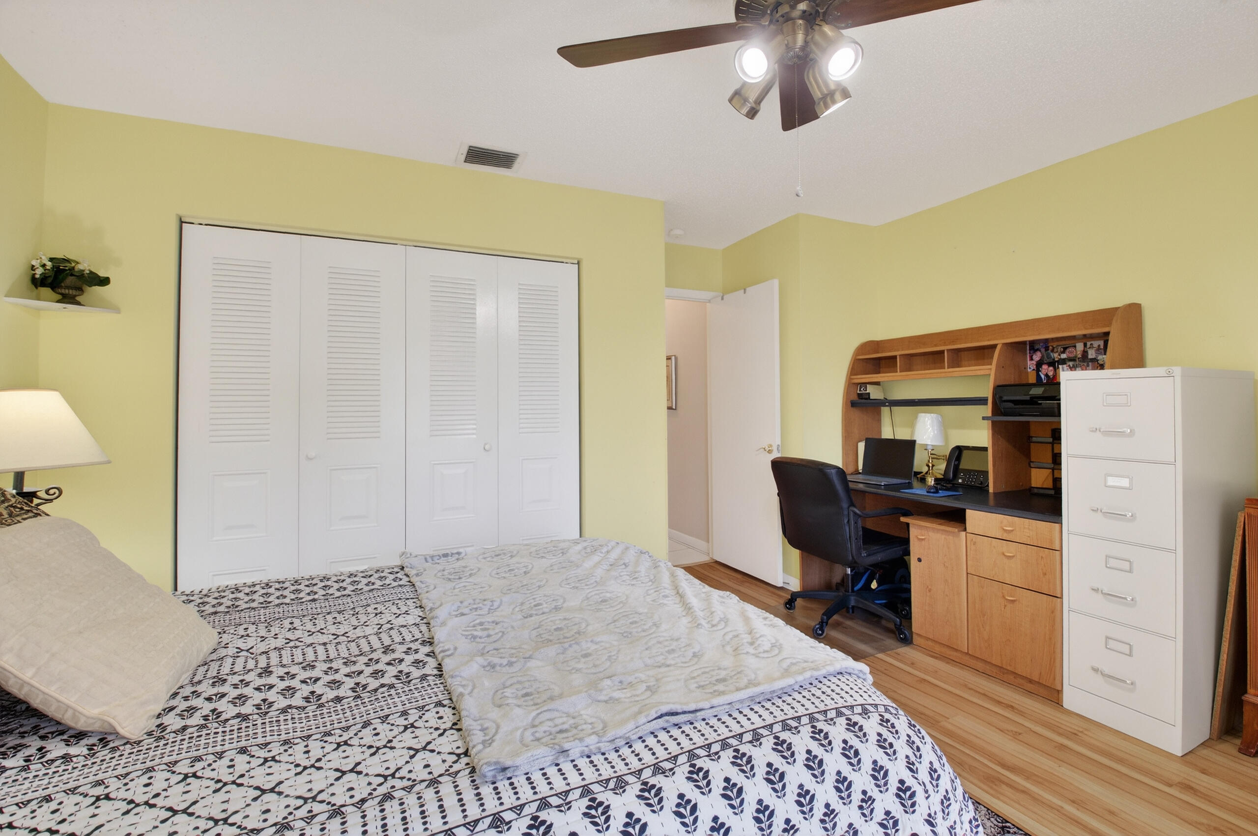 2601 Northwest 15th Street Delray Beach, FL 33445 - Photo 29 of 59 a bedroom with a bed and a table in it