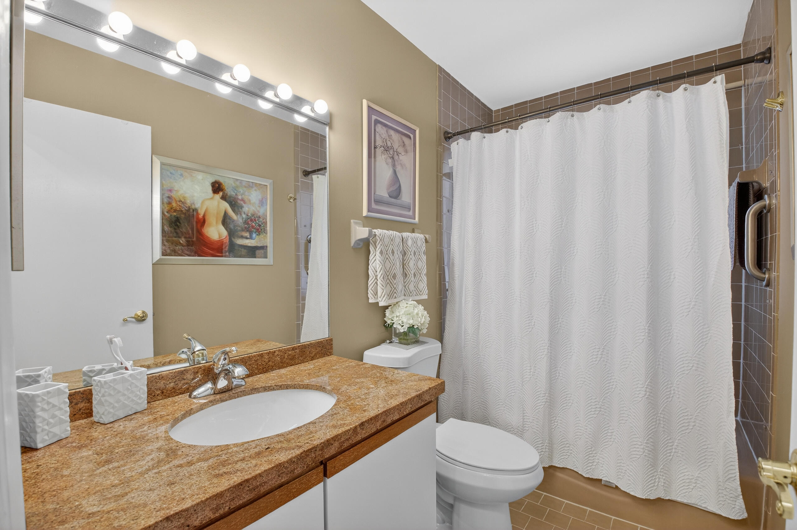 2601 Northwest 15th Street Delray Beach, FL 33445 - Photo 30 of 59 a bathroom with a granite countertop sink toilet and shower