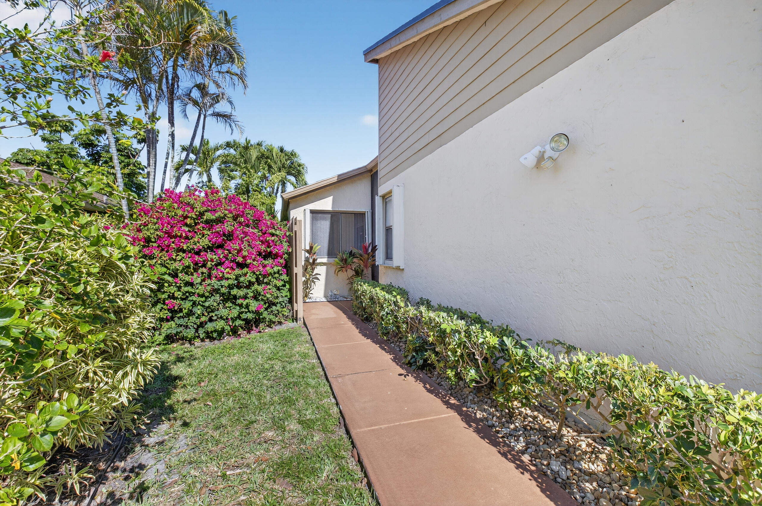2601 Northwest 15th Street Delray Beach, FL 33445 - Photo 4 of 59 a view of a pathway in outside of the house
