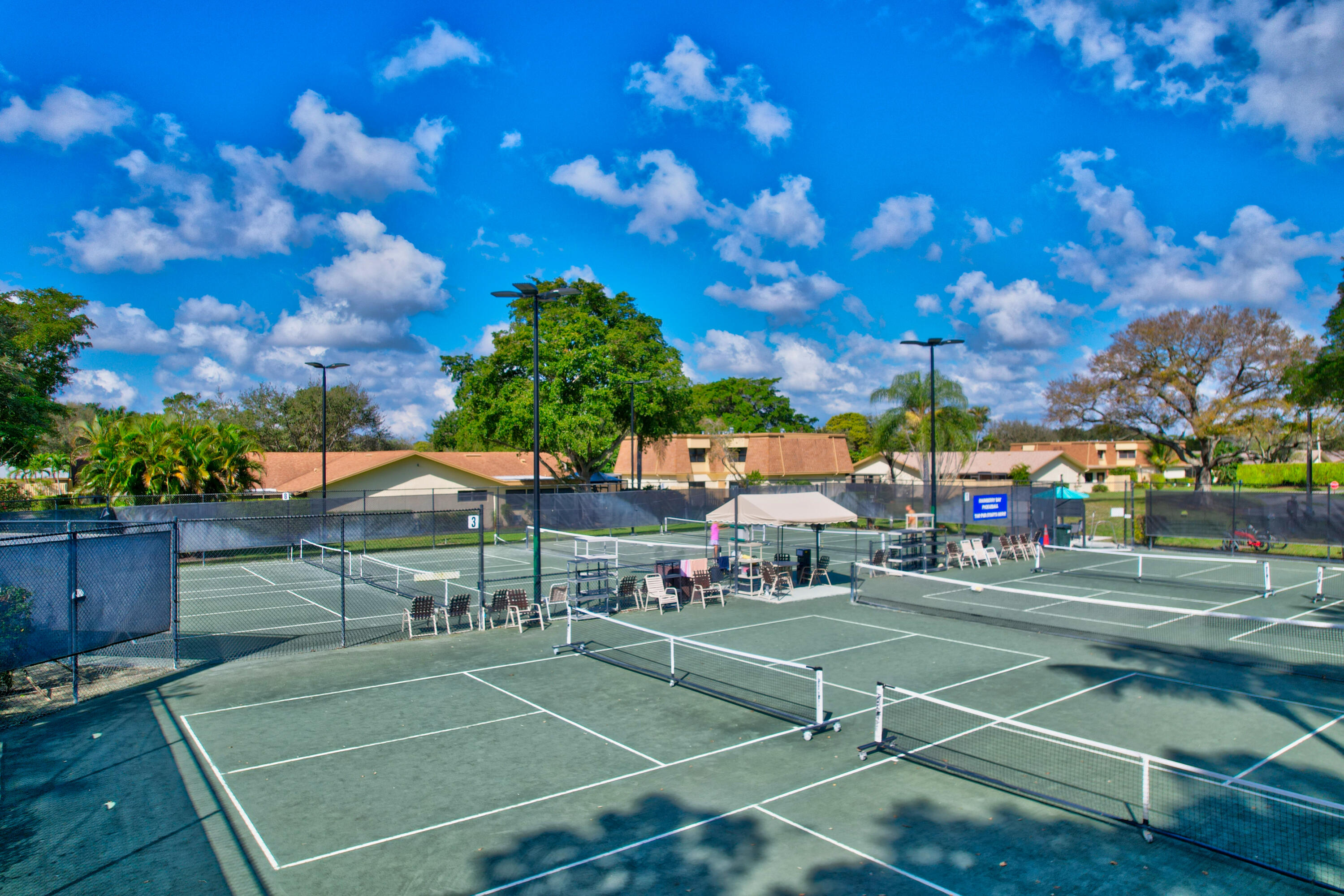 2601 Northwest 15th Street Delray Beach, FL 33445 - Photo 42 of 59 a view of a tennis ground with large trees