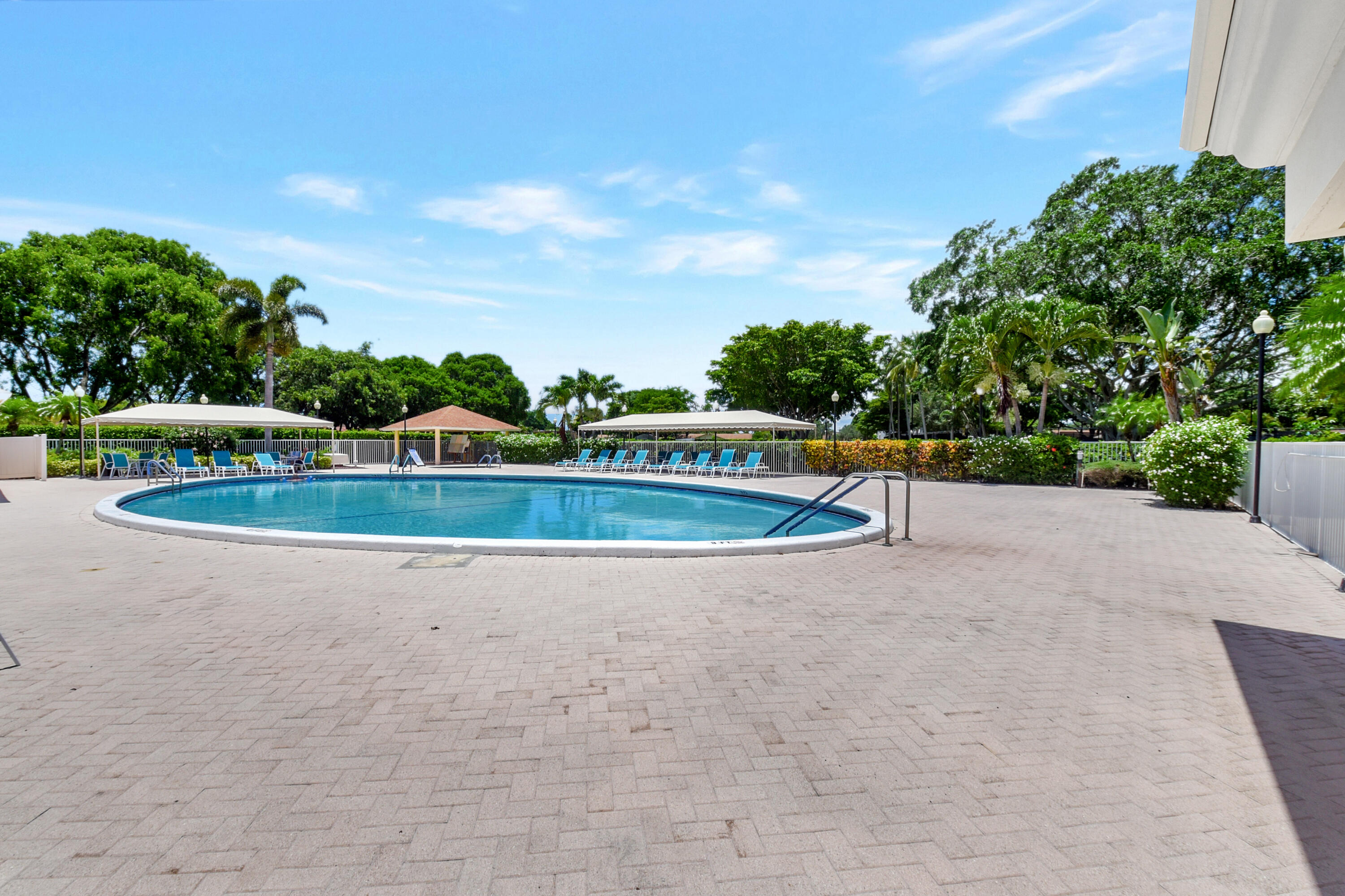 2601 Northwest 15th Street Delray Beach, FL 33445 - Photo 50 of 59 a view of swimming pool with a garden and trees