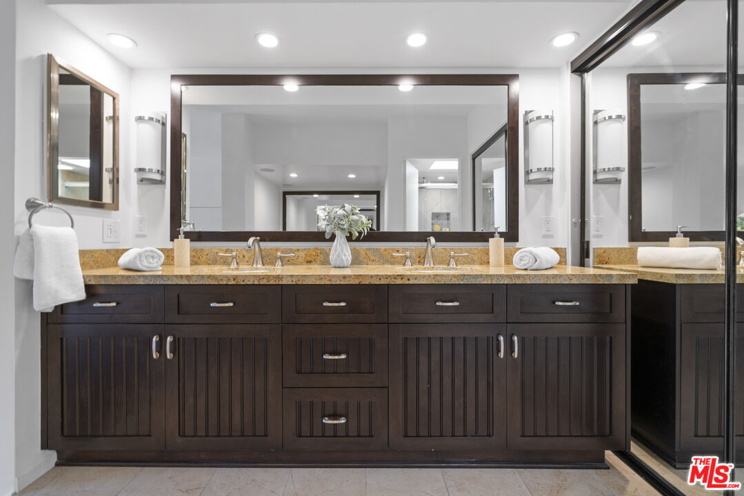 4549 Alla Road, Unit 3 Marina del Rey, CA 90292 - Photo 13 of 28 a bathroom with a granite countertop sink and a mirror