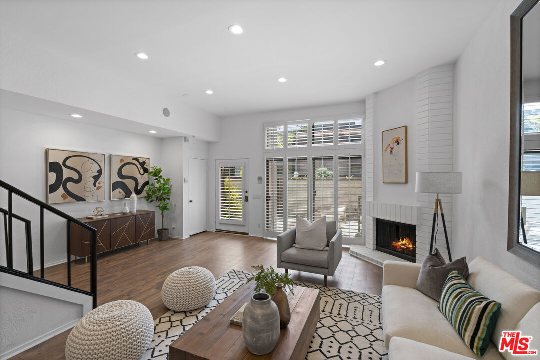 4549 Alla Road, Unit 3 Marina del Rey, CA 90292 - Photo 2 of 28 a living room with furniture and a fireplace