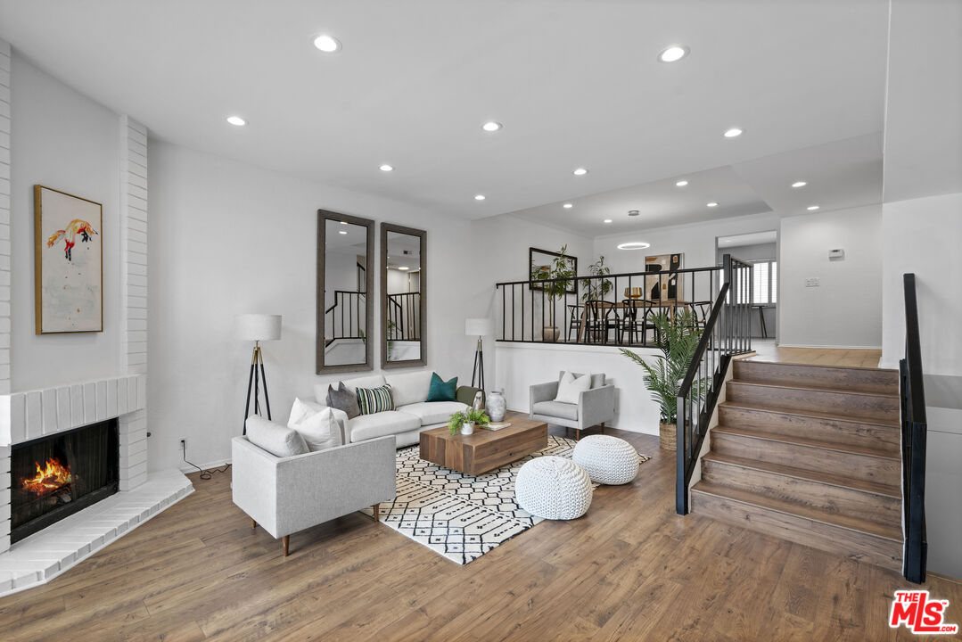 4549 Alla Road, Unit 3 Marina del Rey, CA 90292 - Photo 3 of 28 a living room with furniture and a fireplace