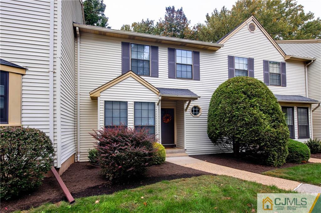 205 Timber Oaks Road, Unit 205 Edison, NJ 08820 - Photo 2 of 31 a front view of a house with garden