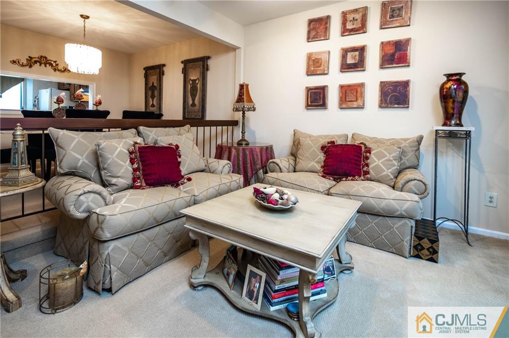 205 Timber Oaks Road, Unit 205 Edison, NJ 08820 - Photo 13 of 31 a living room with furniture and wooden floor