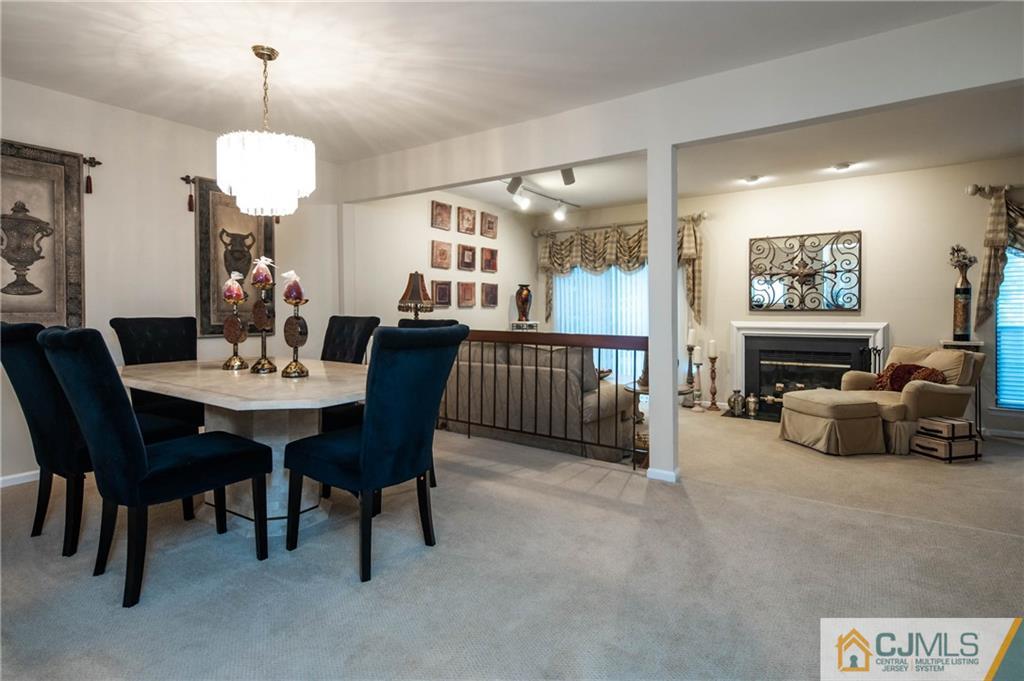 205 Timber Oaks Road, Unit 205 Edison, NJ 08820 - Photo 17 of 31 a view of a dining room with furniture window and outside view