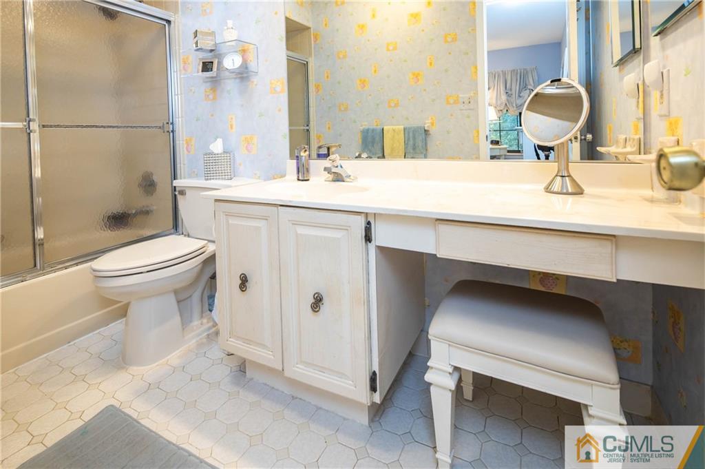 205 Timber Oaks Road, Unit 205 Edison, NJ 08820 - Photo 23 of 31 a bathroom with a sink toilet a mirror and shower