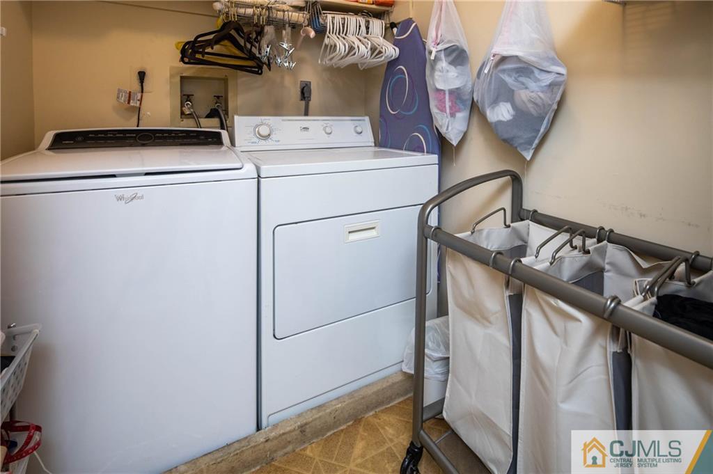 205 Timber Oaks Road, Unit 205 Edison, NJ 08820 - Photo 26 of 31 a utility room with dryer and washer