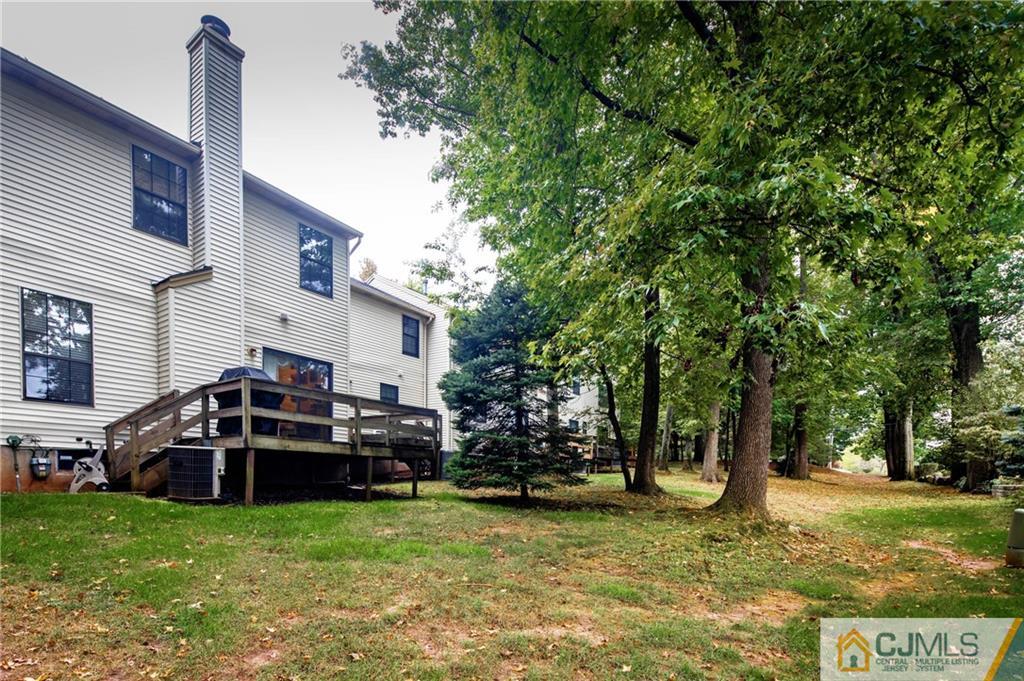 205 Timber Oaks Road, Unit 205 Edison, NJ 08820 - Photo 29 of 31 a view of a house with a back yard